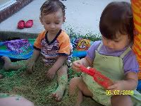 Summer and Chase in the sandbox